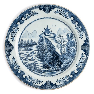 Lot 34 - A LARGE CHINESE BLUE AND WHITE 'LANDSCAPE' CHARGER, QING DYNASTY, 18TH CENTURY