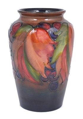 Lot 50 - LEAF AND BERRY: A SLENDER OVOID MOORCROFT FLAMBÃ‰ VASE