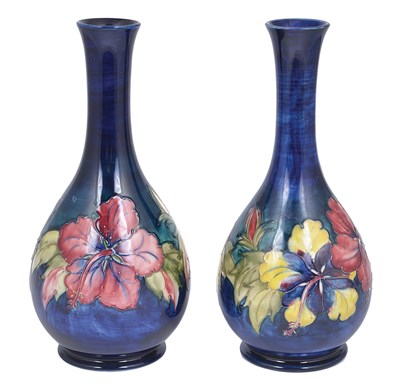 Lot 56 - HIBISCUS: A PAIR OF MOORCROFT SLENDER BOTTLE VASES