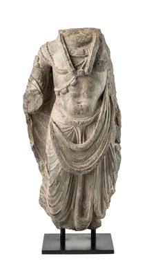 Lot 559 - A GANDHARA GREY SCHIST TORSO PROBABLY OF MAITREYA, NORTH-WESTERN PAKISTAN, 2ND/3RD CENTURY