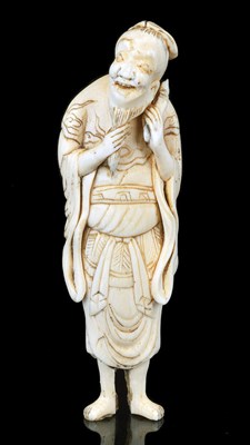 Lot 103 - A JAPANESE IVORY NETSUKE OF A SENNIN