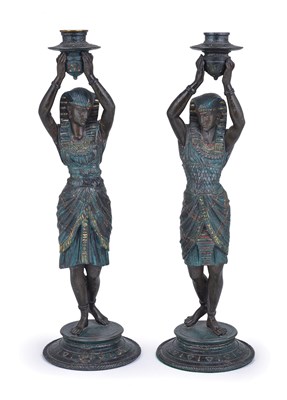 Lot 134 - A PAIR OF PATINATED SPELTER EGYPTIANESQUE FIGURAL CANDLESTICKS