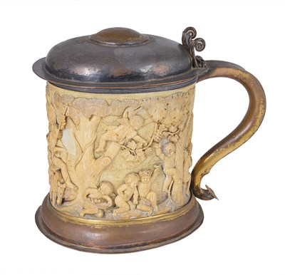 Lot 141 - A GILT-COPPER AND IVORY TANKARD