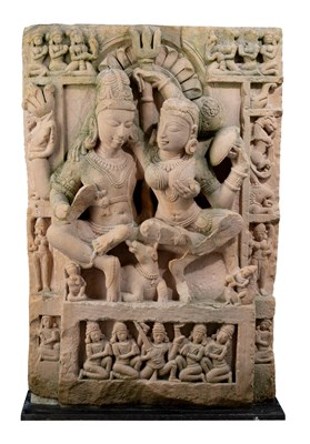 Lot 197 - A BUFF SANDSTONE RELIEF PANEL DEPICTING UMAMAHESVARA, CENTRAL INDIA, 11TH/12TH CENTURY