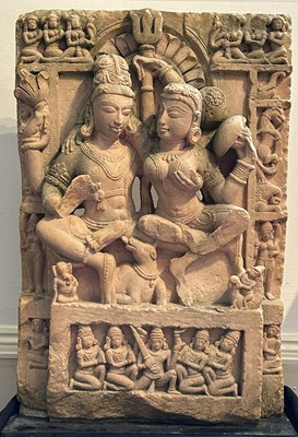 Lot 197 - A BUFF SANDSTONE RELIEF PANEL DEPICTING UMAMAHESVARA, CENTRAL INDIA, 11TH/12TH CENTURY