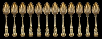 Lot 185 - A SET OF TWELVE GEORGE III SILVER-GILT DESSERT SPOONS