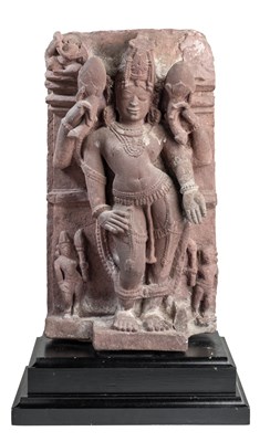 Lot 201 - A PINK SANDSTONE RELIEF PANEL DEPICTING SURYA, CENTRAL INDIA, 11TH/12TH CENTURY