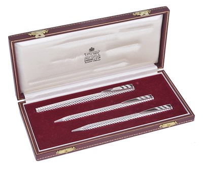 Lot 276 - A CASED SET OF THREE WHITE GOLD AND DIAMOND-SET PENS