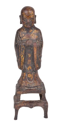 Lot 71 - A CHINESE GILDED BRONZE FIGURE OF A MONK