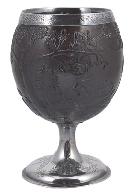 Lot 153 - A SILVER-MOUNTED CARVED COCONUT CUP