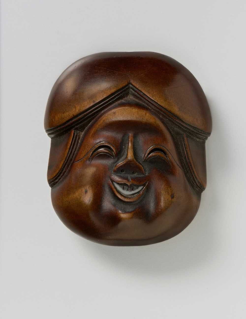 Lot 146 - A JAPANESE MASK NETSUKE OF OKAME