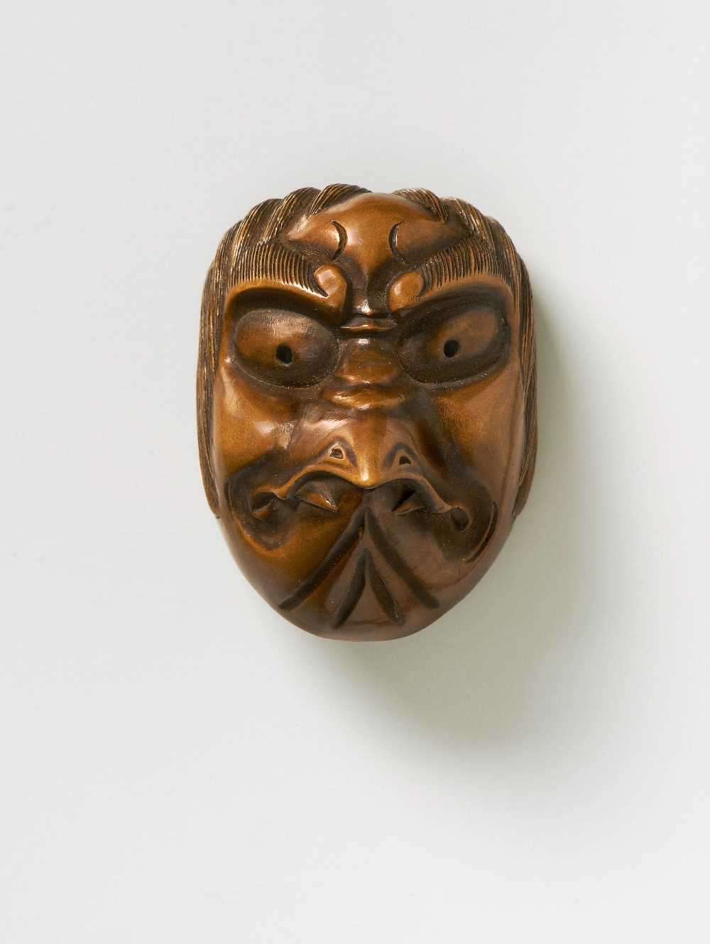 Lot 177 - A JAPANESE MASK NETSUKE OF KARASU-TENGU
