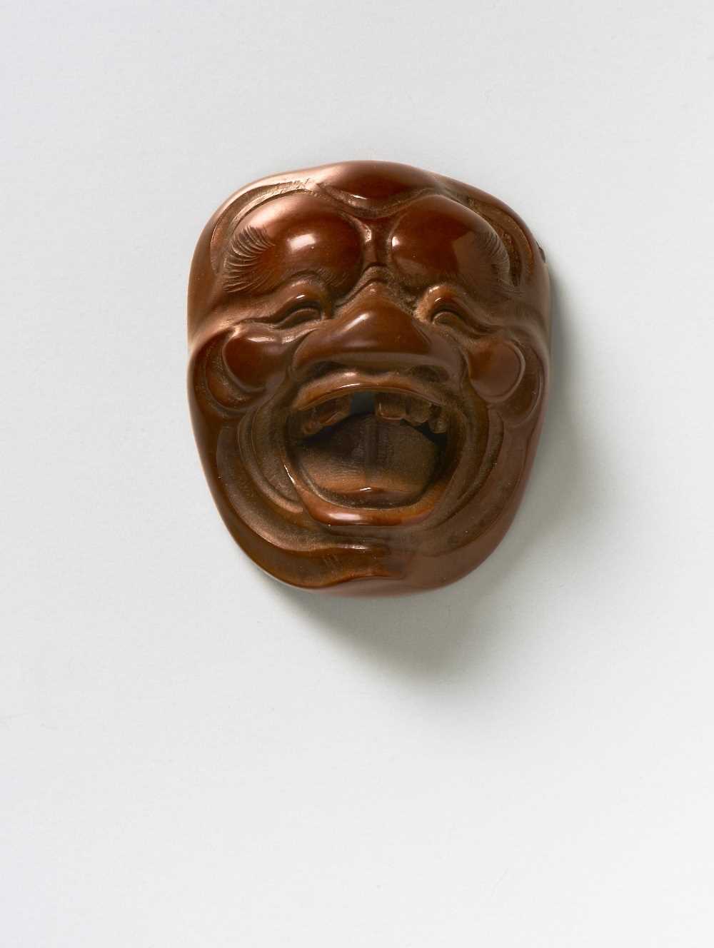 Lot 230 - A JAPANESE MASK NETSUKE OF A LAUGHING OLD MAN