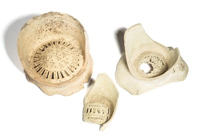 Lot 506 - THREE FRAGMENTARY FATIMID WATER FILTERS, FUSTAT, EGYPT, 10TH/11TH CENTURY