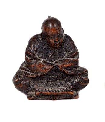 Lot 80 - A JAPANESE WOOD NETSUKE OF A TRADESMAN