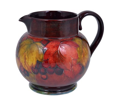 Lot 103 - A MOORCROFT 'LEAF AND BERRY' FLAMBÃ‰ JUG