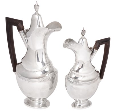 Lot 140 - A PAIR OF PORTUGUESE SILVER EWERS IN SIZES