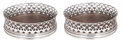 Lot 143 - A PAIR OF PORTUGUESE SILVER WINE COASTERS