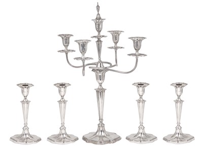 Lot 195 - A SUITE OF FOUR EDWARDIAN SILVER CANDLESTICKS AND A CANDELABRUM