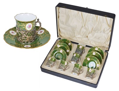 Lot 171 - A SET OF SIX GEORGE V SILVER HOLDERS WITH DEMI-TASSE CUPS AND SAUCERS