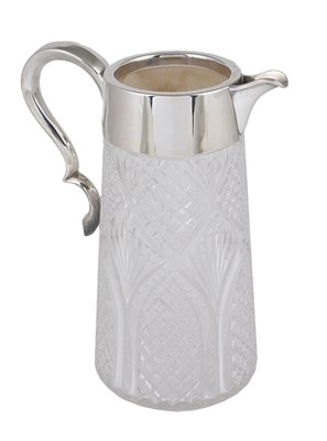 Lot 218 - A VICTORIAN SILVER-MOUNTED WATER JUG