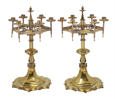 Lot 239 - A PAIR OF VICTORIAN SILVER-GILT GOTHIC PATTERN CANDELABRA