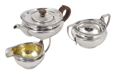 Lot 260 - A GEORGE III SILVER MATCHING THREE-PIECE TEA SET