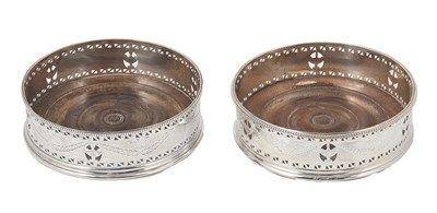 Lot 271 - A PAIR OF GEORGE III SILVER WINE COASTERS