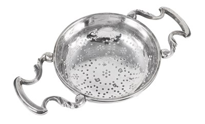 Lot 294 - A GEORGE II SILVER LEMON STRAINER