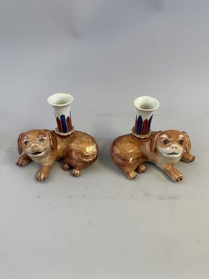 Lot 66 - A PAIR OF CHINESE PUG DOG CANDLE HOLDERS, QING DYNASTY, QIANLONG PERIOD (1736-95)