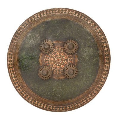 Lot 81 - AN INDIAN SMALL LACQUERED HIDE SHIELD (DHAL)