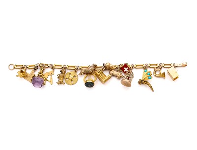 Lot 311 - GOLD CHARM BRACELET, 1930s