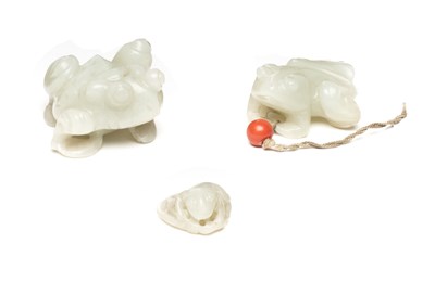 Lot 27 - TWO CHINESE CARVED JADE FROGS