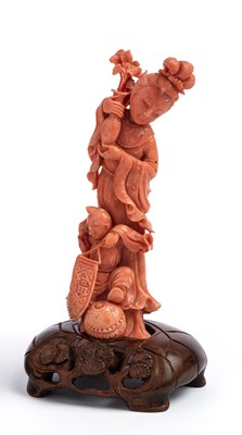 Lot 33 - ËœA CHINESE CORAL GROUP OF A MAIDEN AND YOUNG BOY