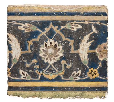 Lot 38 - A SAFAVID CUERDA SECA BORDER TILE