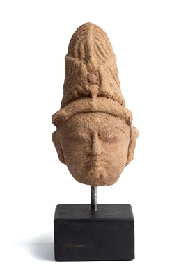 Lot 65 - A SMALL BUFF SANDSTONE HEAD OF A DEITY