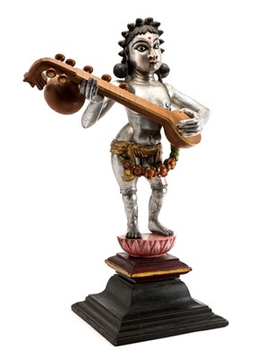 Lot 126 - A FIGURE OF A CELESTIAL MUSICIAN