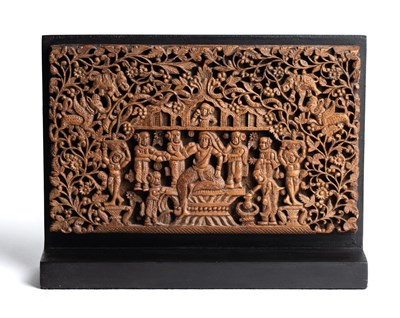 Lot 128 - A SMALL CARVED WOOD PANEL