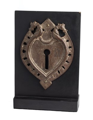 Lot 142 - A BRONZE ESCUTCHEON