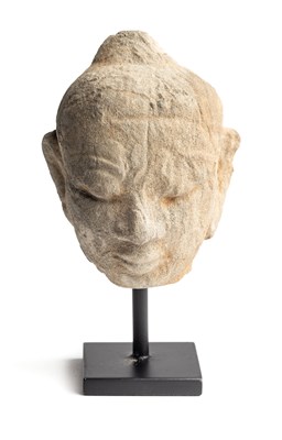 Lot 216 - A BUFF SANDSTONE HEAD OF BUDDHA