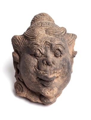 Lot 219 - A MAJAPAHIT TERRACOTTA HEAD OF A DVARAPALA