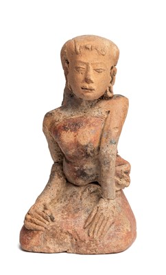 Lot 226 - A MAJAPAHIT TERRACOTTA FIGURE OF A KNEELING MAIDEN