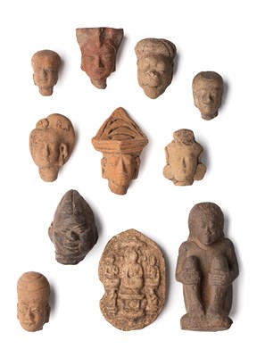 Lot 230 - A COLLECTION OF NINE MAJAPAHIT TERRACOTTA HEADS