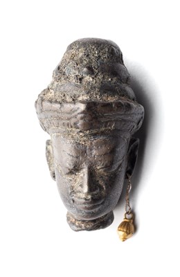 Lot 248 - A SMALL KHMER BRONZE HEAD OF A DEITY