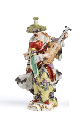 Lot 498 - A MEISSEN OUTSIDE DECORATED FIGURE OF A MALE 'MALABAR MUSICIAN'