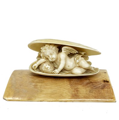 Lot 523 - ËœA SMALL IVORY SLEEPING FIGURE