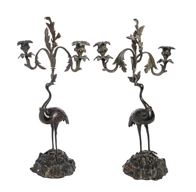 Lot 528 - A PAIR OF BRONZE AND BRASS 'STORK' CANDELABRA