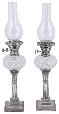 Lot 611 - A PAIR OF VICTORIAN SILVER CANDLESTICK OIL LAMPS