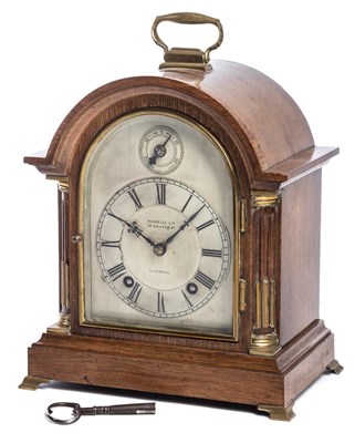 Lot 655 - â’¼ A GERMAN OAK MANTEL CLOCK