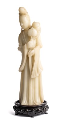 Lot 51 - A CHINESE SOAPSTONE FIGURE OF GUANYIN